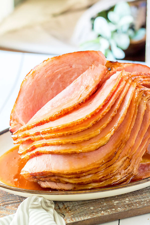 a spiral ham with the slices fall over on a platter