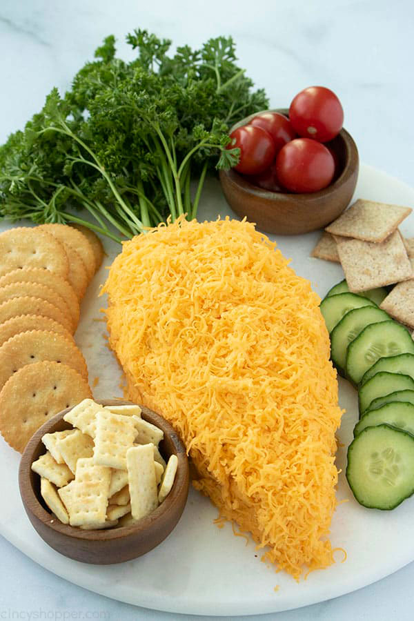 a cheese ball in the shape of a giant carrot