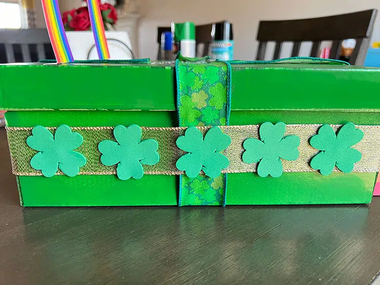 foam shamrocks decorating the side of a shoebox leprechaun trap