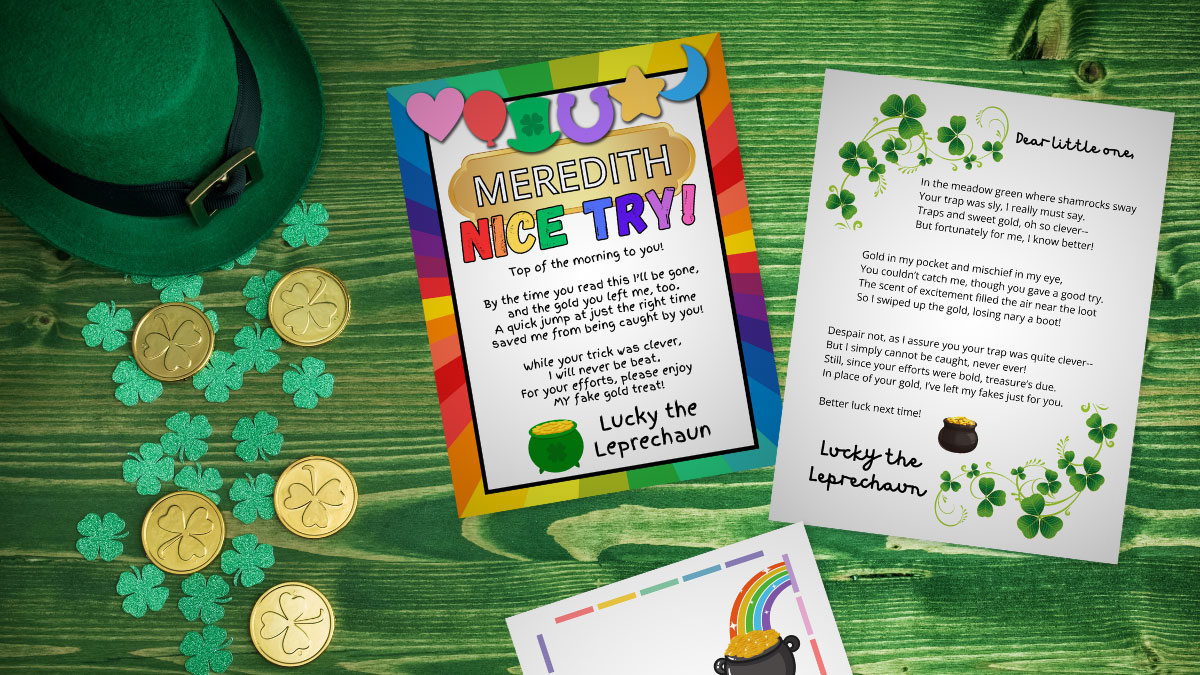 multiple designs of leprechaun trap notes lying on a green wood desk with a leprechaun hat, clovers, and gold coins