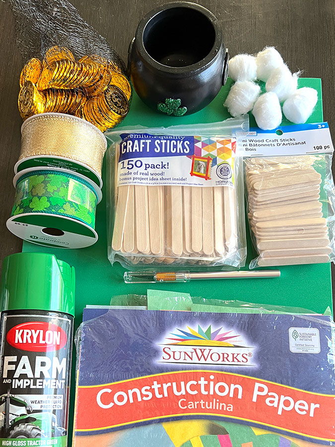 various crafting materials that can be used to create a shoebox leprechaun trap