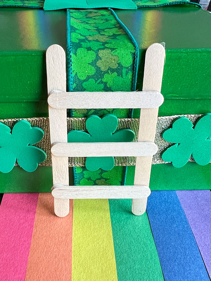 a leprechaun-sized wooden ladder made from craft popsicle sticks