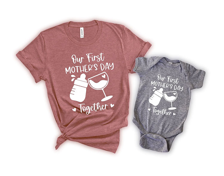 matching t-shirt and baby bodysuit tat read "Our First Mother's Day Together" with an image of a baby bottle and wine glass