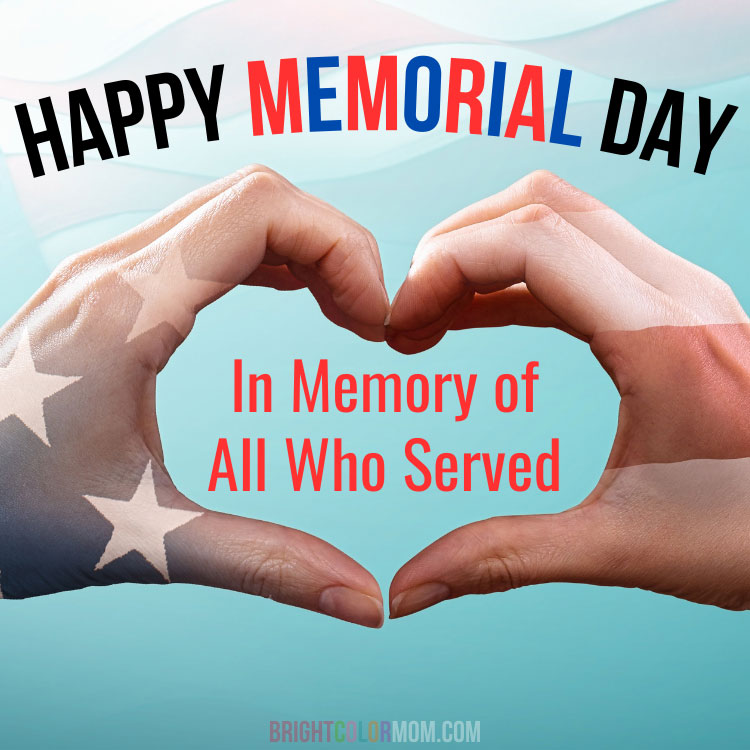 two hands forming a heart shape with an American flag projected on them, and a text overlay: "Happy Memorial Day: In Memory of All Who Served"