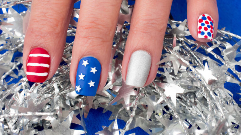 square nails painted in red, white, and blue designs