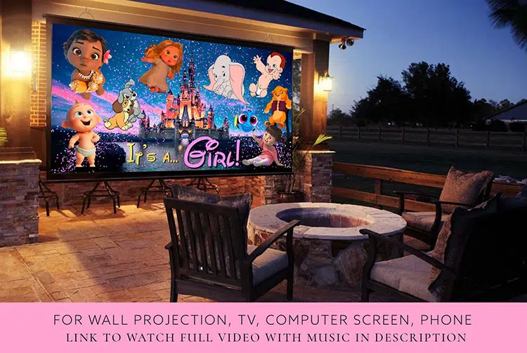 a gender reveal video is shown on an outdoor TV screen in the evening