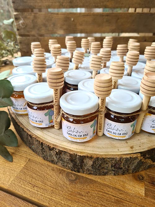 mini jars with custom labels and honey dippers