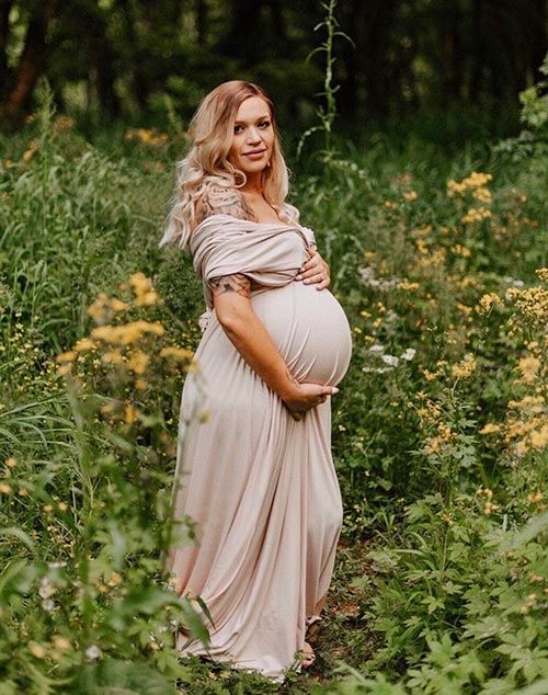 woman wearing flowing mauve maternity dress