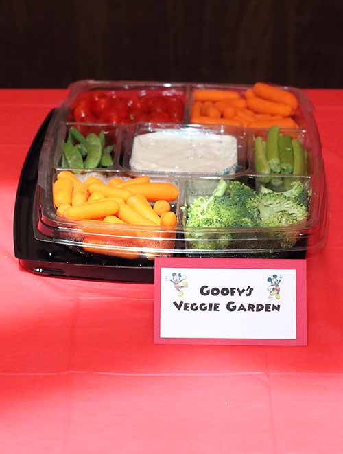 a veggie platter with a card that reads "Goofy's Veggie Garden"