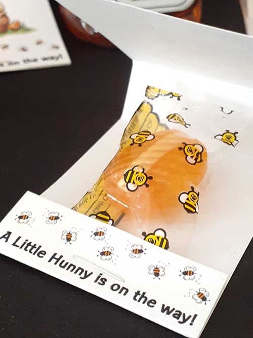 a bee party favor pouch with a hard honey candy inside