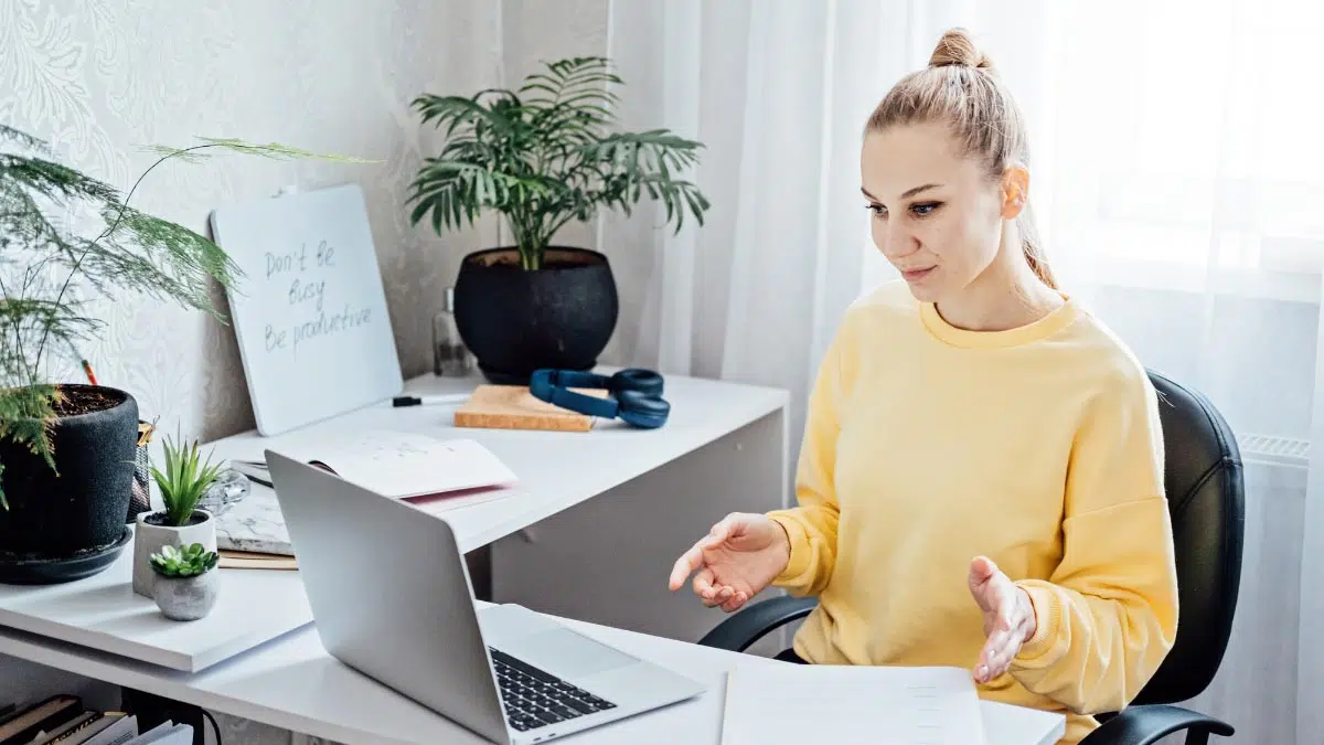 a woman sitting at a desk in a home office