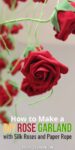 closeup of a single silk red rose hanging from a paper vine with this text overlay: "How to Make a DIY Rose Garland with Silk Roses and Paper Rope"