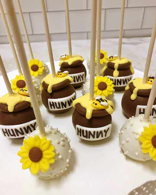 chocolate cake pops decorated to look like honey pots