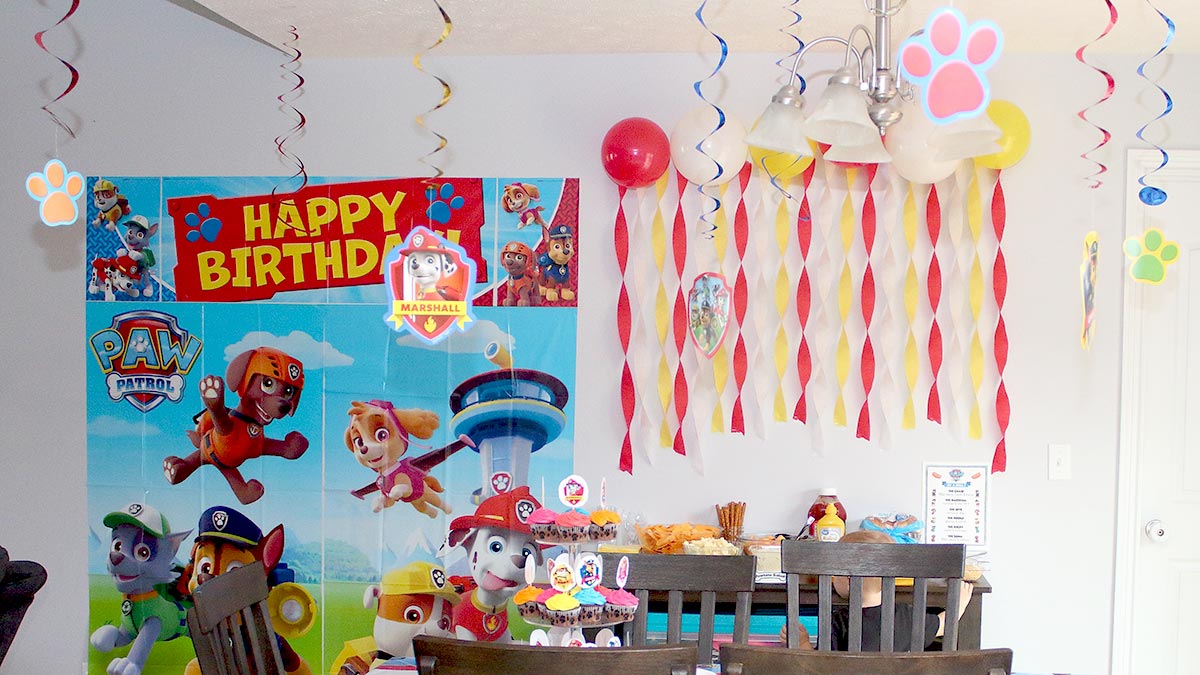 a kitchen decorated for a Paw Patrol birthday party