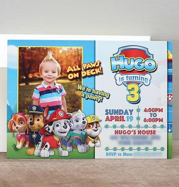 a Paw Patrol birthday invitation featuring a photo of the birthday boy