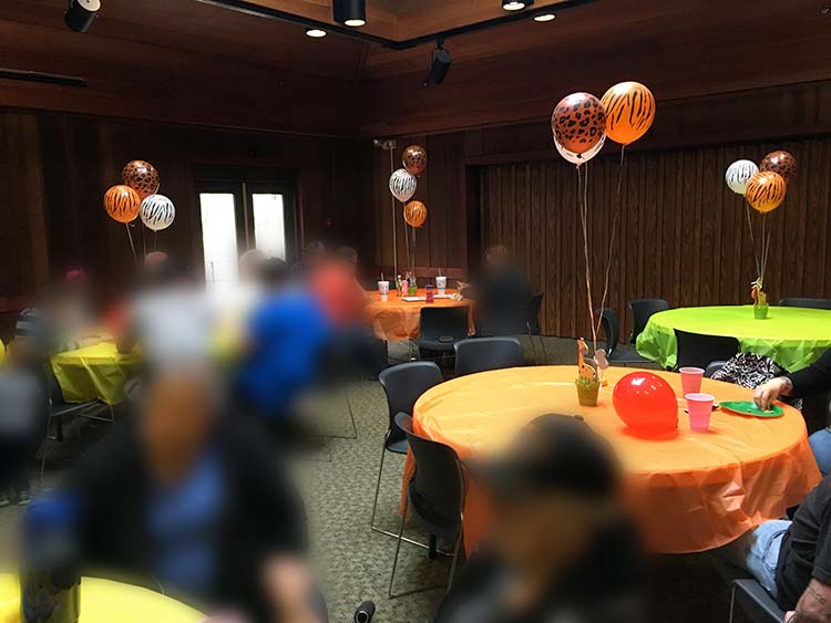 a party venue with tables set up in a safari birthday party theme