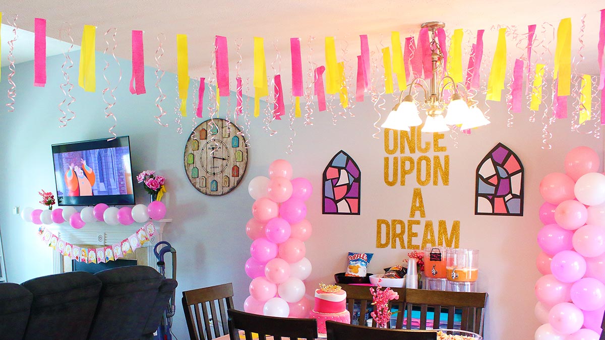 an open-concept home fully decorated for a Sleeping Beauty birthday party