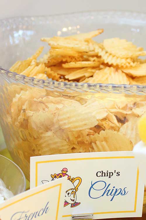 a bowl of ruffled chips labeled "Chip's Chips" featuring the chipped teacup from Beauty and the Beast