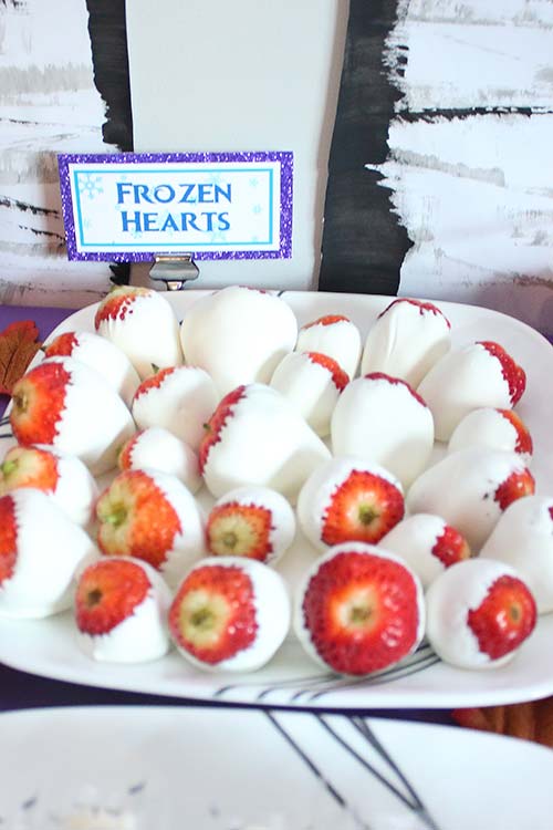 a plate of white chocolate-covered strawberries labeled "Frozen Hearts"