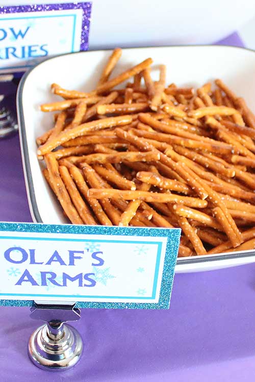 a bowl of pretzel sticks labeled "Olaf's arms"