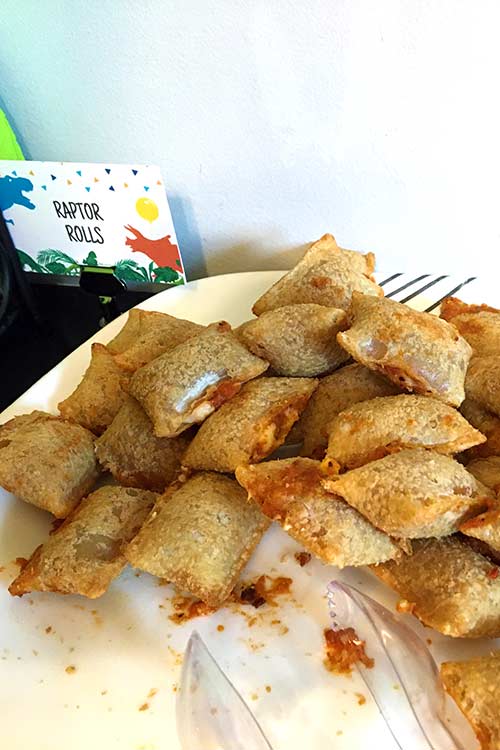a plate of pizza rolls labeled "raptor rolls"