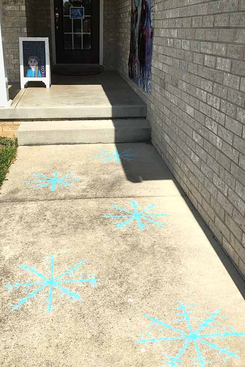 blue snowflakes drawn in sidewalk chalk