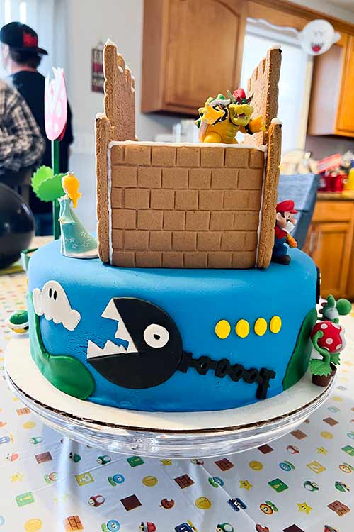 side view of a Mario cake featuring a Chain Chomp