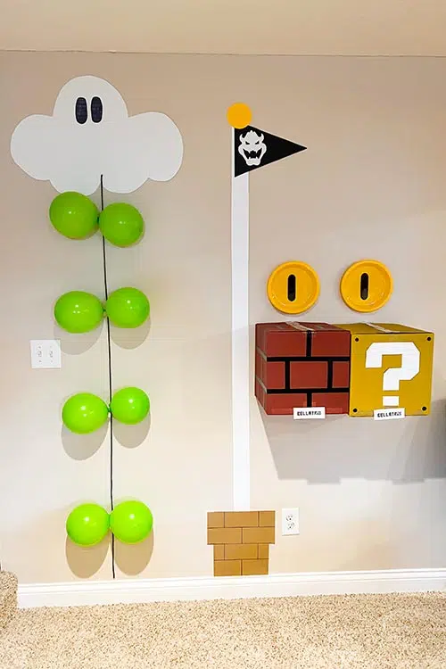 a balloon ladder and Mario flagpole on a wall