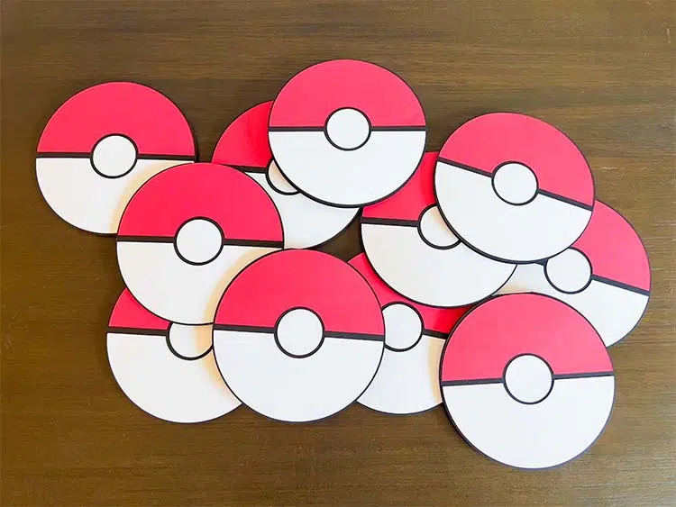 several cardstock Poke balls lying on a table