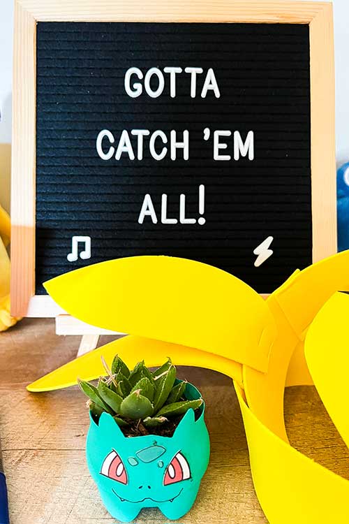 a letter board that says "Gotta Catch 'Em All!"