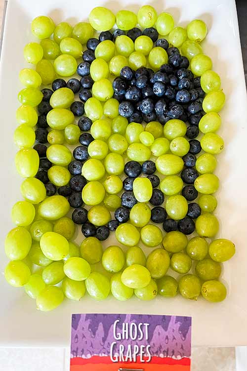 platter of grapes and blueberries