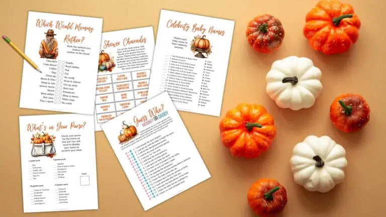 printable pumpkin-themed baby shower games on a table with mini pumpkins