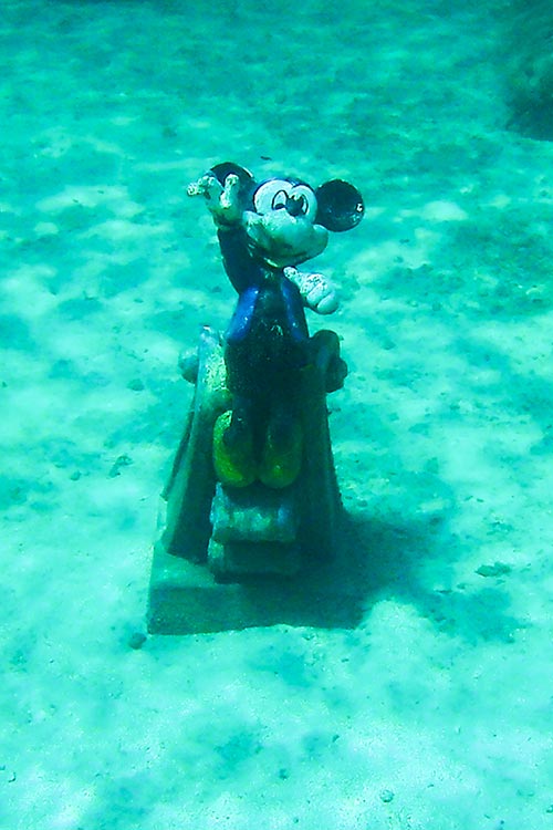 a Mickey Mouse statue underwater