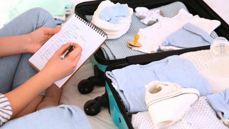 a woman checking off a baby travel checklist