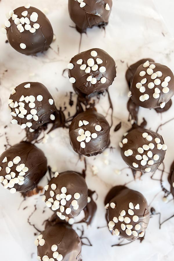 freshly made chocolate chip cookie dough brownie bombs on wax paper