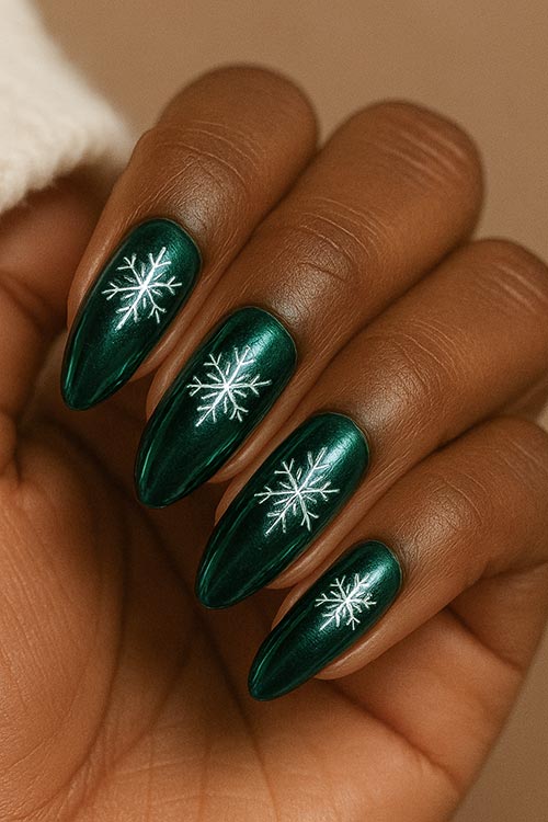 long almond Christmas nails with dark green chrome polish