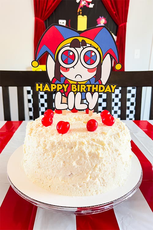 Amazing Digital Circus birthday cake with topper featuring Pomni