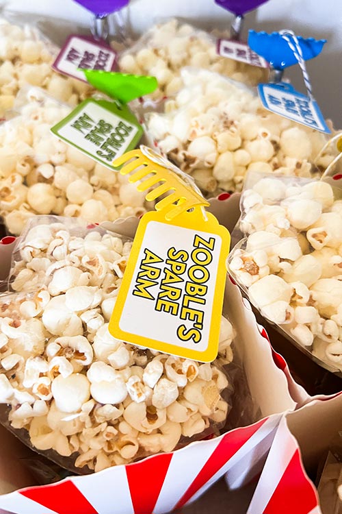 closeup of Amazing Digital Circus party favor tag on backscratcher labeled Zooble's Spare Arm