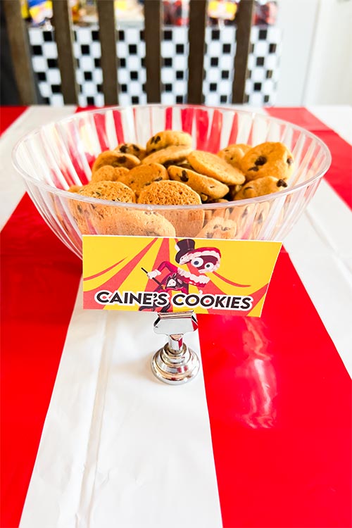 bowl of chocolate chip cookies labeled Caine's Cookies