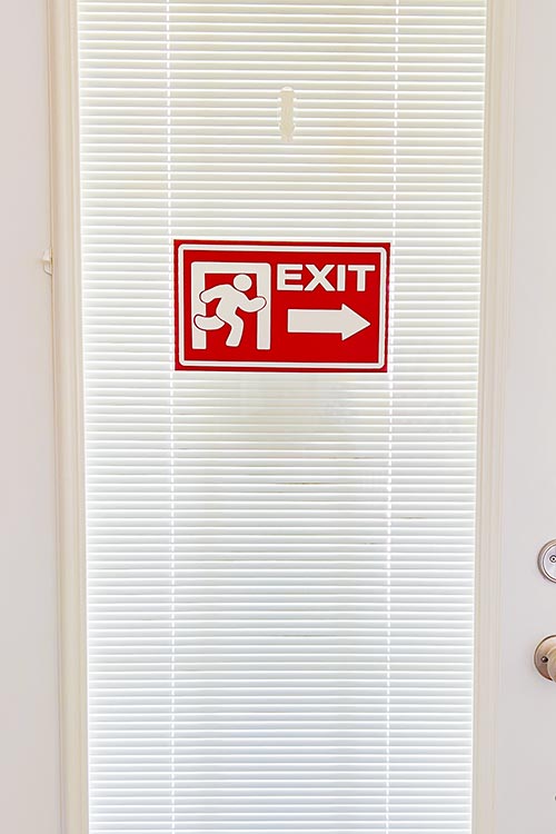 inside of front door with an Amazing Digital Circus exit sign