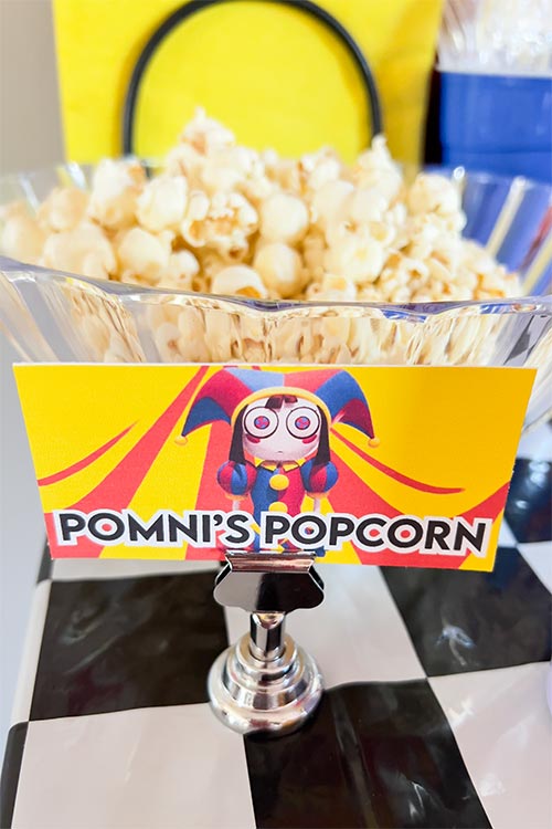 bowl of popcorn labeled Pomni's Popcorn