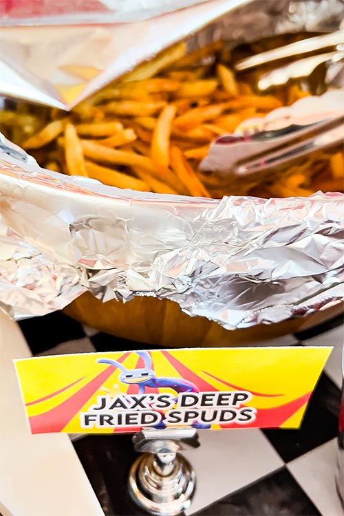bowl of shoestring fries labeled Jax's Deep-Fried Spuds