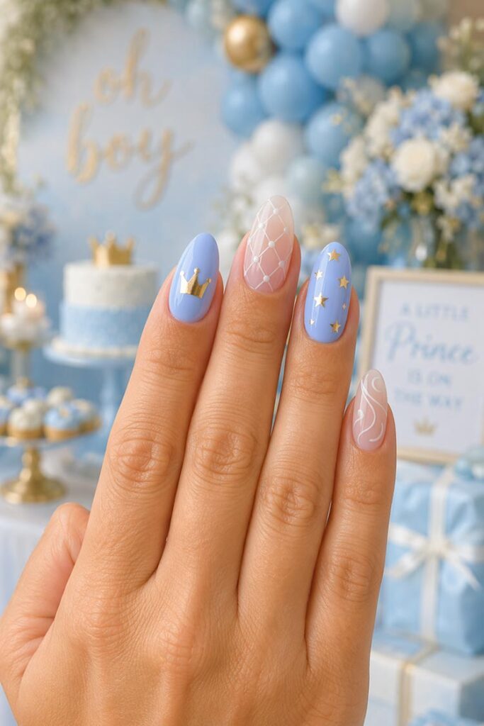 Blue baby shower nails with gold crown, stars, and quilted accent