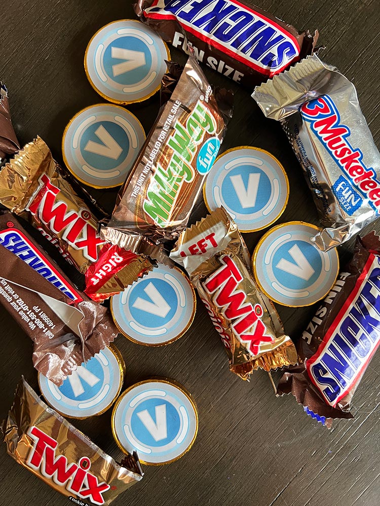 Chocolate coins and candy bars styled as Fortnite V-Bucks party treats