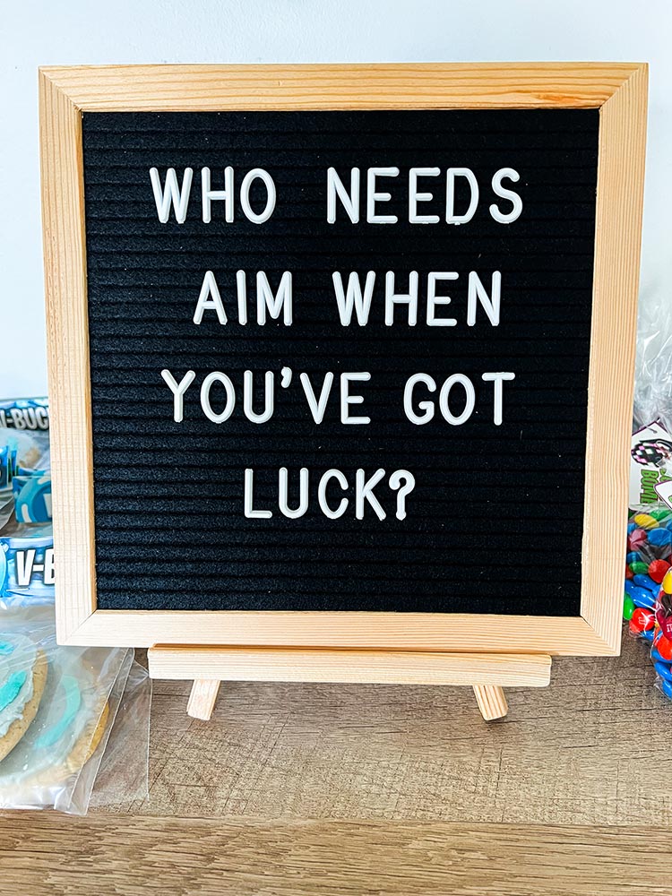 Letter board sign with Fortnite quote about aim and luck