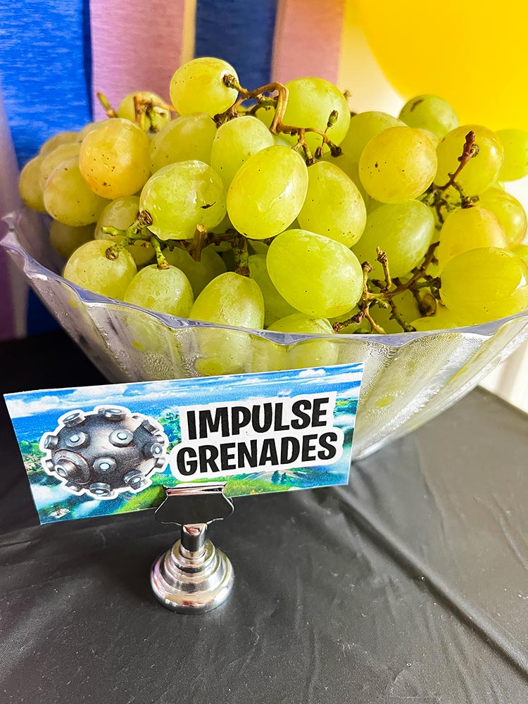 Green grapes labeled as Fortnite Impulse Grenades party snack