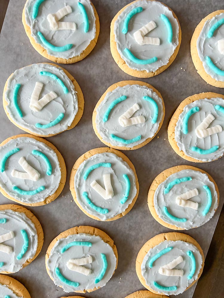 Homemade Fortnite V-Bucks cookies with blue icing design